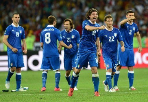 Italian players celebrate during the penalty shoot out