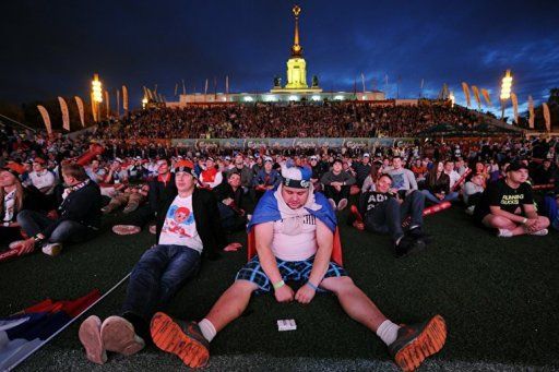 Russian football fans reacts while watchin on a giant screen the Group A match between Russia and Greece