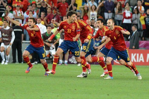 Spanish players celebrate at the end of the penalty shoot out