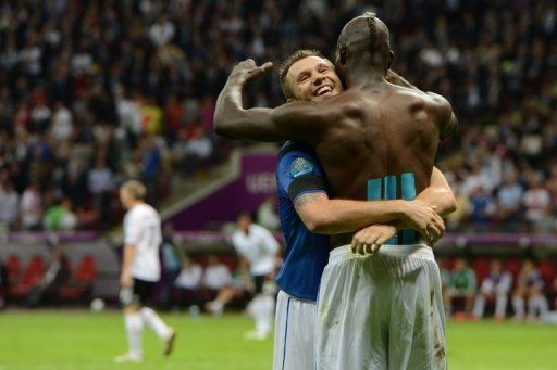 Italian forward Mario Balotelli (R) celebrates with Italian forward Antonio Cassano