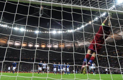 Italian goalkeeper Gianluigi Buffon saves a shot on goal