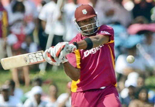 West Indies cricketer Kieron Pollard hits a boundary