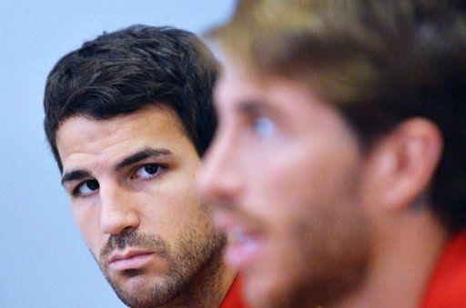 Spanish defender Sergio Ramos (R) and midfielder Cesc Fabregas attend a press conference in Kiev on June 29