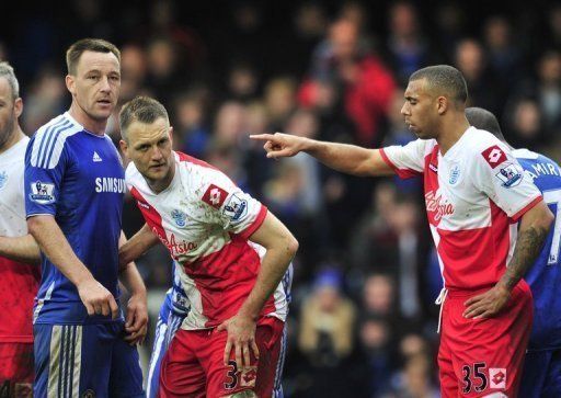 Chelsea defender John Terry (L) and Queens Park Rangers defender Anton Ferdinand