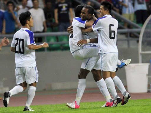 Didier Drogba (2nd rught) came on in the second half for Shanghai Shenhua