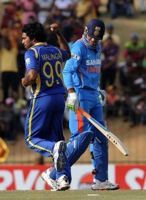 Sri Lankan bowler Lasith Malinga celebrates the dismissal of Indian batsman Irfan Pathan in Hambantota