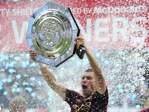 Man City&#039;s Aleksandar Kolarov lifts the FA Community Shield trophy