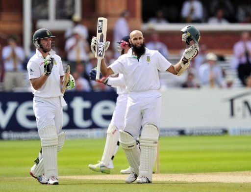 South Africa&#039;s Hashim Amla celebrates his century during the fourth day of the third International Test cricket match