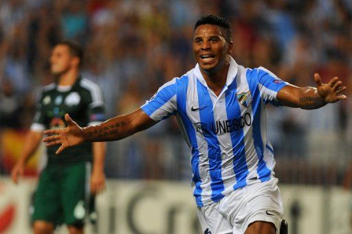 Malaga&#039;s Portuguese midfielder Eliseu celebrates after scoring