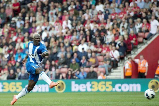 Wigan&#039;s striker Arouna Kone shoots to score