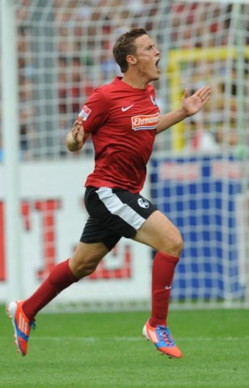 Freiburg's midfielder Max Kruse celebrates scoring