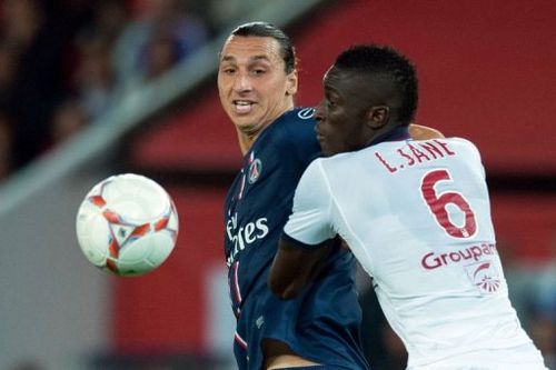 Paris Saint-Germain's Zlatan Ibrahimovic (L) vies with Bordeaux's Ludovic Sane