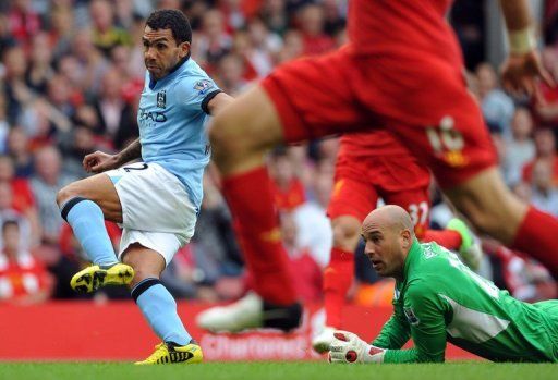 Carlos Tevez scored Manchester City&#039;s second goal at Liverpool to secure his side a point in a 2-2 draw