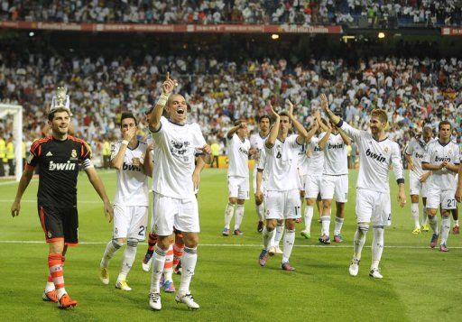 Real Madrid&#039;s players celebrate their victory 2-1 over Barcelona