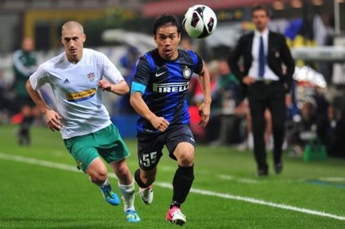 Vaslui's Polish defender Piotr Celeban (L) runs for the ball with Inter Milan's Japanese midfielder Yuto Nagatomo