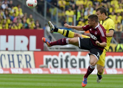 Dortmund&#039;s midfielder Ivan Perisic (R) and Nuremberg&#039;s striker Robert Mak fight for the ball