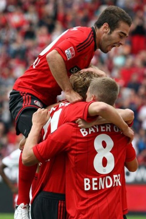 Leverkusen's Daniel Carvajal (top), Stefan Kiessling (C) and Lars Bender (R) celebrate with Gonzalo Castro