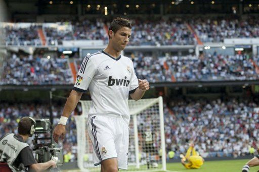 Real Madrid&#039;s Portuguese forward Cristiano Ronaldo reacts after scoring on September 2