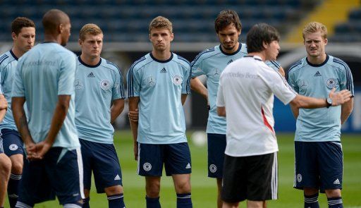 Loew (2nd R) says his team is still hungry for success after Euro 2012