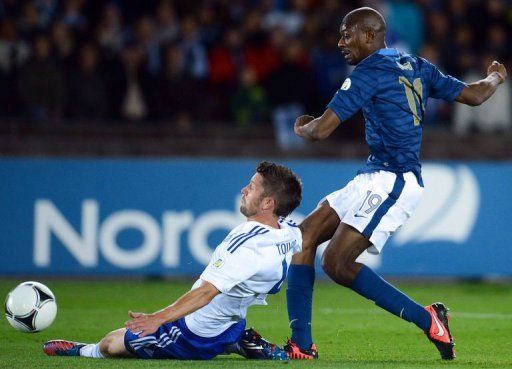 French midfielder Abou Diaby (R) scores