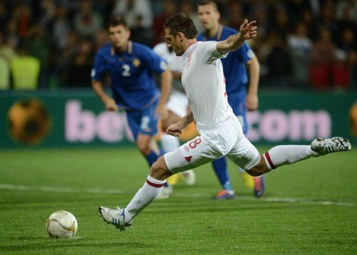 Frank Lampard of England takes a penalty