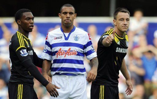 Queens Park Rangers&#039; defender Anton Ferdinand (2nd L) is seen with Chelsea&#039;s defender John Terry (R)