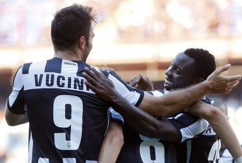 Juventus' Kwadwo Asamoah (R) celebrates with teammate Mirko Vulcinic