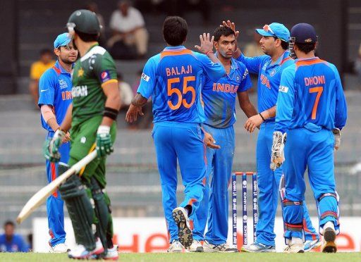 Indian cricketer Ravichandran Ashwin (third right) is congratulated by his teammates