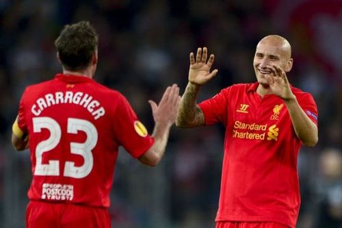 Liverpool's midfielder Jonjo Shelvey (R) celebrates with teammate Jamie Carragher