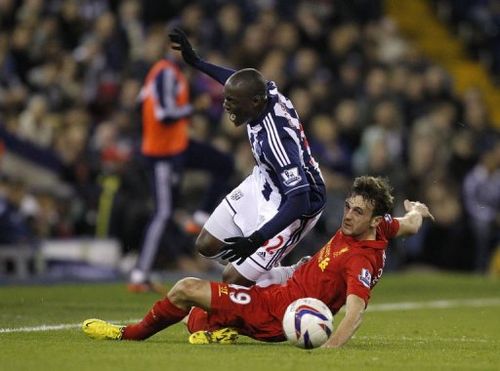 West Bromwich Albion's Marc-Antoine Fortune (L) is tackled by Liverpool's Jack Robinson