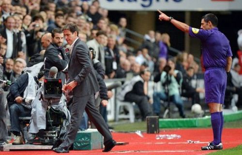 Lille's head coach Rudi Garcia (L) is sent off by referee Nicolas Rainville