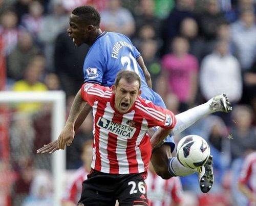 Sunderland's striker Steven Fletcher clashes with Wigan's defender Maynor Figueroa (up)