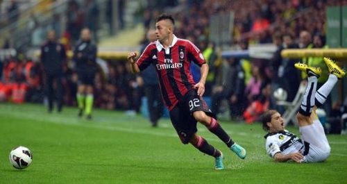 AC Milan's forward Stephan El Shaarawy (R) escapes with the ball