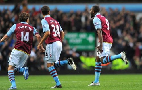 Aston Villa's Darren Bent (R) celebrates after scoring