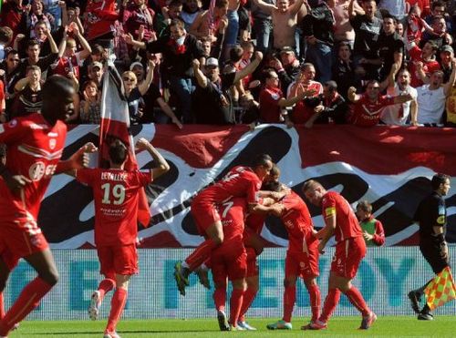 Valenciennes' Gael Danic (C) is congratulated by teammates after scoring