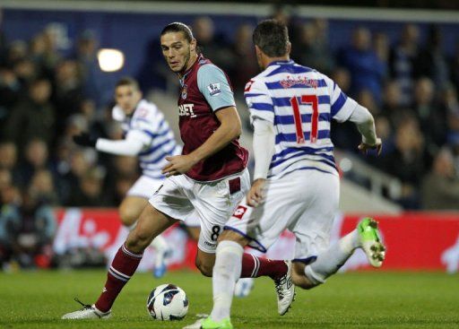 West Ham United&#039;s Andy Carroll (L) vies with Queens Park Rangers&#039; Ryan Nelsen