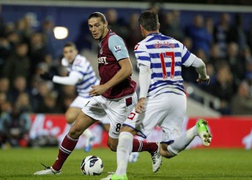 West Ham United's Andy Carroll (L) vies with Queens Park Rangers' Ryan Nelsen