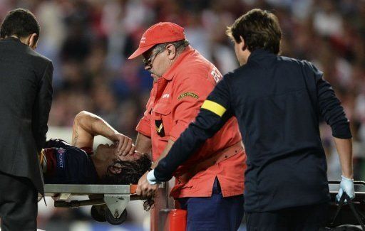 Barcelona&#039;s captain Carles Puyol is stretchered out