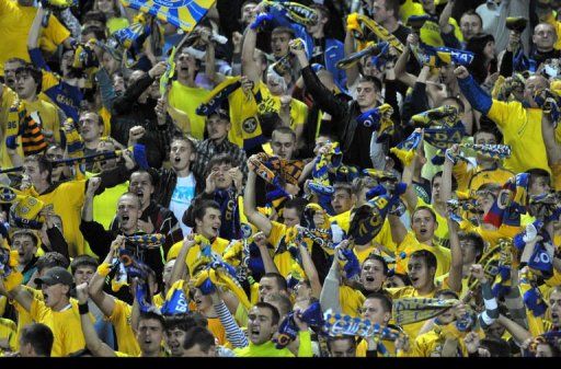BATE Borisov&#039;s fans watch their team&#039;s soccer match against Bayern Munich of the Champions League Group F in Minsk