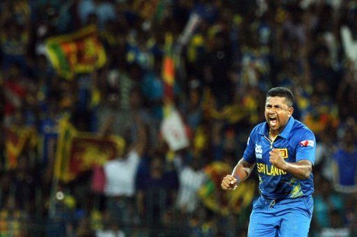 Sri Lanka cricketer Rangana Herath celebrates dismissing Pakistan cricketer Mohammad Hafeez