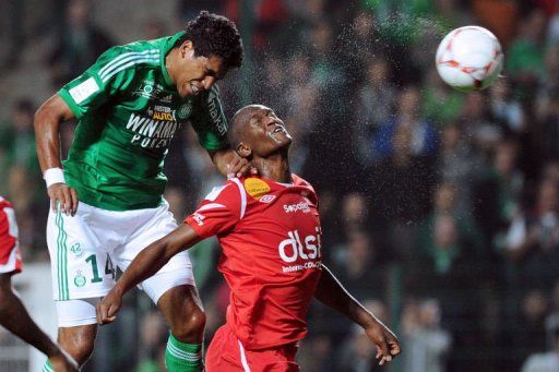 Saint-Etienne&#039;s Brazilian forward Brandao (L) heads and scores