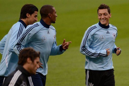 Germany&Acirc;&acute;s midfielder Mesut Oezil (R), Sami Khedira and Jerome Boateng (C)