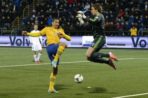 Swedish forward Zlatan Ibrahimovic (C) scores past Faroe's goalkeeper Gunnar Nielsen