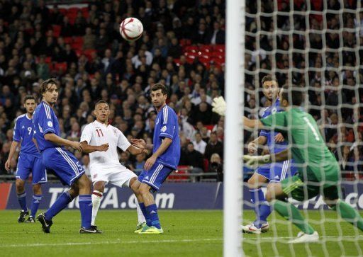 England&#039;s Alex Oxlade-Chamberlain (3rd L) scores his country&#039;s fifth goal against San Marino on Friday