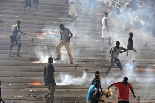 Football fans set fire to the stands at the L&Atilde;&copy;opold S&Atilde;&copy;dar Senghor stadium in Dakar on October 13