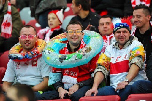 Polish fans appear in high spirits ahead of the match despite anger over the rescheduling