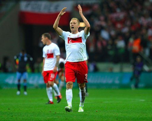 Poland&#039;s Kamil Glik celebrates scoring the equalizer