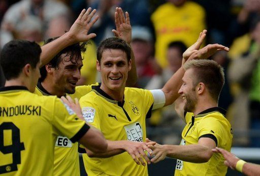 Dortmund take on third-placed Schalke at home on Saturday with a nine-point gap to close behind Bayern