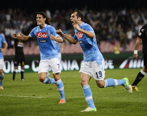 Napoli&#039;s Edinson Cavani (L) tops the league scoring charts on six goals