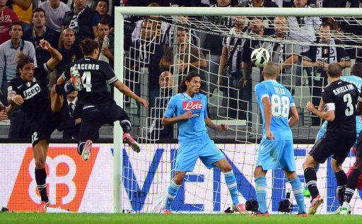 Juventus&#039; Jose Caceres (2ndL) scores a goal